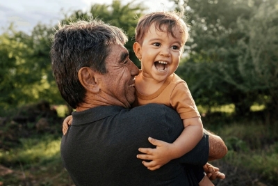 Grandfather playing with toddler